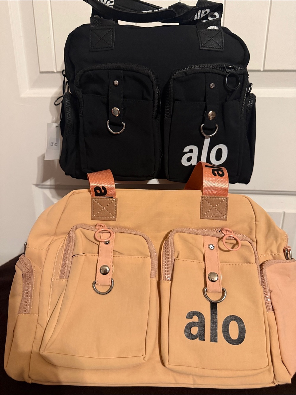 ALO Yoga Men's Convertible Duffel Bag in Black and Peach price each